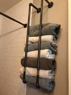 a towel rack in the corner of a bathroom