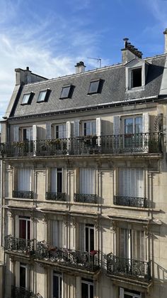 an apartment building with balconies and windows