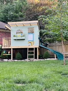 a house with a slide in the back yard