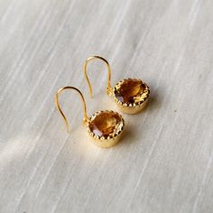 This beautiful pair of Earring has Citrine embedded in 925 sterling silver, and Gold Plated to a high shine. This pair matches with your every outfit to give you a classy and elegant look. Upgrade your accessory collection today with this must have piece today. D E T A I L S - material : sterling silver stone : Citrine polish : gold polished finish : smooth and polished to a high shine S H I P P I N G & P R O D U C T I O N - My current production time is 2-6 business days, which means after Round Crystal Earrings With Ear Wire For Anniversary, Luxury Sterling Silver Earrings For Gift, Wedding Earrings In Sterling Silver With Polished Finish, Crystal Round Earrings For Anniversary, Fine Jewelry Sterling Silver Earrings, Polished Finish Drop Earrings For Wedding, Fine Jewelry Sterling Silver Hallmarked Earrings, Wedding Drop Earrings With Polished Finish, Polished Sterling Silver Earrings As A Gift