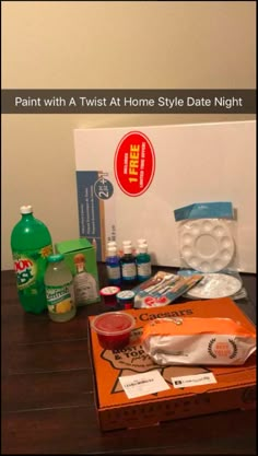 the contents of a home style date night box are displayed on a wooden table in front of a white wall