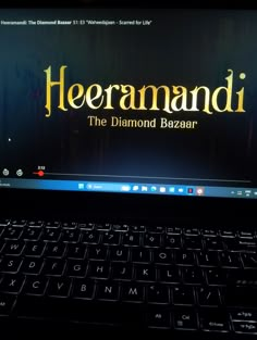 a laptop computer sitting on top of a desk with the words heeramaddi on it