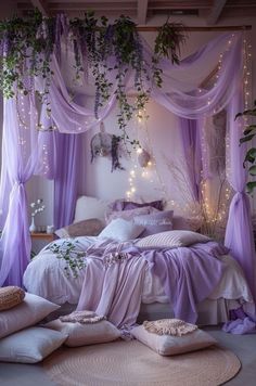 a bedroom decorated in lavender and white with lots of greenery hanging from the ceiling