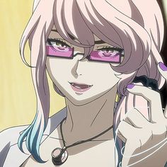 a woman with pink glasses holding a cell phone to her ear and looking at the camera