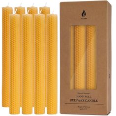 four beeswax candles in a cardboard box