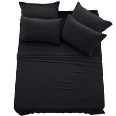 black sheets and pillows on a white background