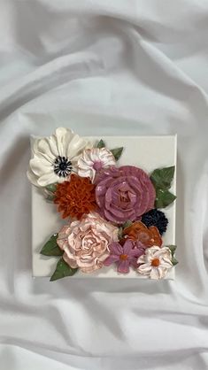 a white plate topped with lots of flowers