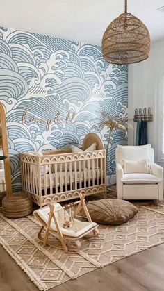 a baby's room decorated in blue and white