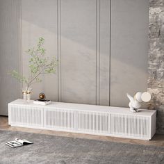 a white radiator sitting on top of a wooden floor next to a wall