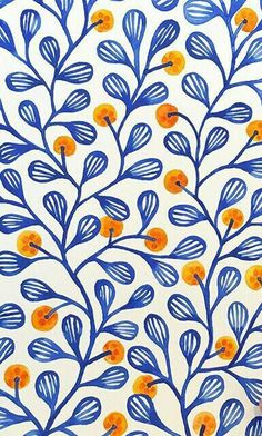 someone is drawing on a wall with blue and orange flowers in the background, while holding a pen