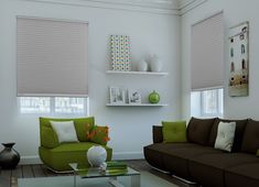 a living room with green and brown furniture