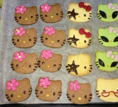 hello kitty cookies are arranged on a baking sheet