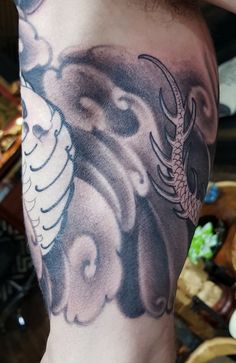 a man with a dragon tattoo on his arm