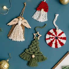 christmas ornaments are displayed on a blue surface