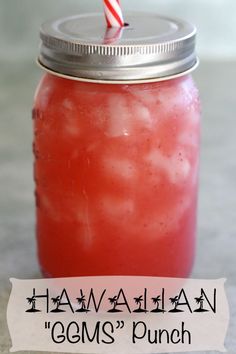 a mason jar filled with watermelon and topped with a candy cane