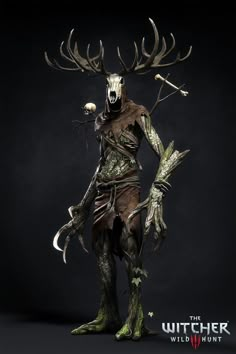 a man dressed as a deer with horns and antlers on his head, standing in front of a black background