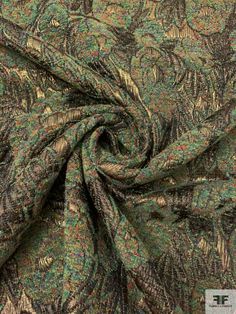 a green and brown paisley print fabric