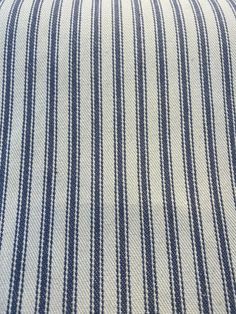 the blue and white striped fabric is close up