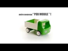 a green toy truck sitting on top of a white surface with the words note neutral pod mobile