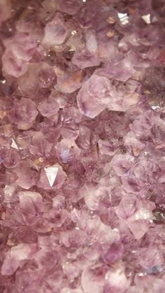 some very pretty pink crystals on a table