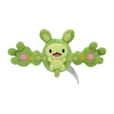 a green stuffed animal with pink eyes and ears on it's back legs, sitting in front of a white background