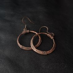 These hammered copper rings marry rustic charm with artisanal elegance. Perfect for those who appreciate unique, earthy accessories. Artisan Nickel-free Rust-colored Jewelry, Artisan Rust-colored Nickel-free Jewelry, Artisan Rust Color Nickel-free Jewelry, Handmade Copper Round Hoop Earrings, Brown Hammered Copper Earrings, Artisan Rust-colored Metal Jewelry, Artisan Bronze Copper Hoop Earrings, Handmade Copper Hoop Earrings, Vintage Handmade Rust Jewelry