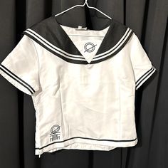 Black And Whole Sailor Style Anime Cosplay Shirt. Xl But Fits Like A Large. Brand New Never Worn. White Top For Halloween Cosplay, White Halloween Cosplay Top, White Harajuku Top For Cosplay, Harajuku Style Anime Print Tops For Cosplay, Anime Style Short Sleeve Top For Cosplay, Harajuku Style Short Sleeve Top For Cosplay, Fitted White Anime Print Top, Fitted White Top With Anime Print, White Short Sleeve School Uniform Top