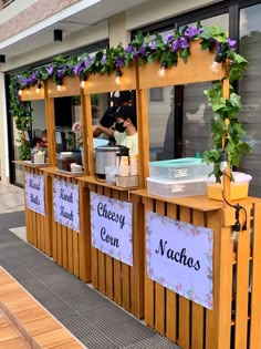 a food stand with signs on the side of it