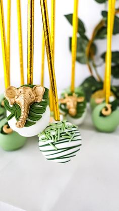 green and gold desserts with elephants on them