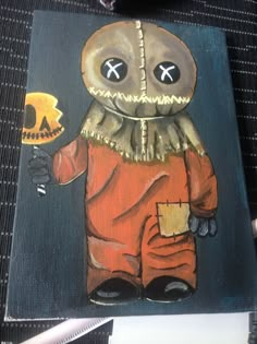 a painting of a cartoon character holding a skull in one hand and a knife in the other