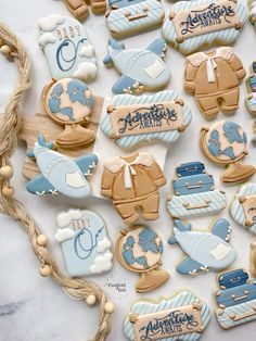 baby shower cookies are arranged on a table