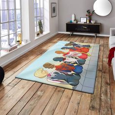 an area rug with cartoon characters on it in a living room next to a couch