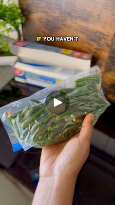 someone is holding up a bag of green beans in front of a computer desk with the words if you haven't