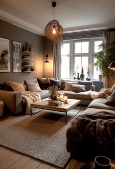 a living room filled with lots of furniture and a lamp on top of a table