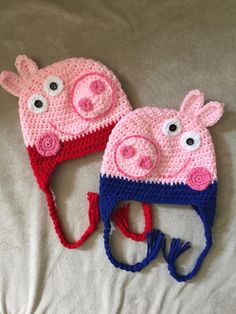 two crocheted hats with pig faces on them