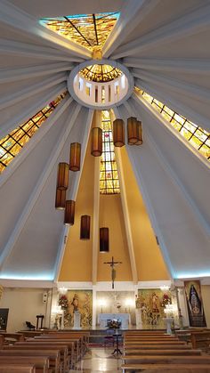 the inside of a church with stained glass windows