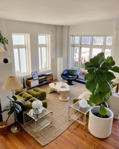 a living room filled with furniture and lots of windows