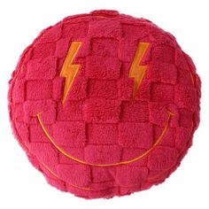 a pink cushion with a lightning bolt on it's face and yellow lines around the edges