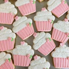 decorated cookies with pink frosting and white icing