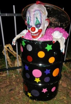 a creepy clown sitting in a trash can