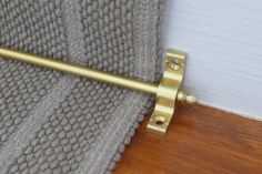 a close up of a door handle on a curtain