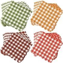 four napkins in different colors and patterns on a white background, each with a gingham design