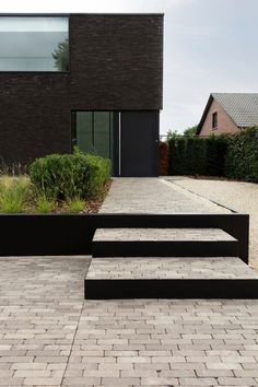 some black steps are in front of a brick building