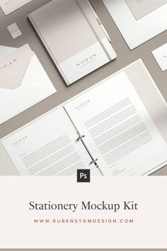 stationery mockup kit with white paper, envelopes and papers on the table