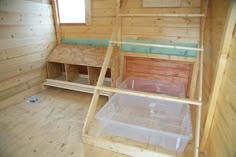 the inside of a wooden cabin with wood flooring and walls that have been made out of plywood