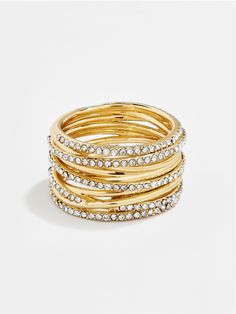 Want the look of stacked rings without all the hassle? The Jamila Ring is here to save the day. This gold and pavé band features criss-crossed metal with chic negative space. It gives the look of layered rings, but you'll know that it's an easy one-and-done add-on. Stacking Gold Rings, Stackable Gold Rings, Multi Band Ring, Rings Adjustable, Dope Jewelry Accessories, Ups Shipping, Layered Rings, Ring Styles, Zirconia Rings