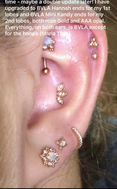 an ear with three different piercings on it