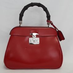 100% Authentic Gucci 331830 Red Smooth Leather Lady Lock Bamboo Top Handle Hand Bag. Small Dint On The Bag Were Caused From Storage Together With Other Bags. Never Been Used Before. Only Took Out Of Bag For Photographing. The Lady Lock Top Handle Satchel Bag Is Characterized By Its Feminine Lock Closure, A Gorgeous Detail. This Bag Looks Glamorous And Sophisticated When Carried In Hand Or On The Arm With A Fashionable Bamboo Top Handle. Measurements: 11.5" L X 4.5" W X 8.75" H Red Gucci Shoulder Bag With Detachable Handle, Gucci Red Shoulder Bag For Travel, Gucci Red Evening Bag, Red Gucci Evening Bag, Luxury Red Gucci Bag, Bamboo Top, Satchel Bag, The Lady, Hand Bag