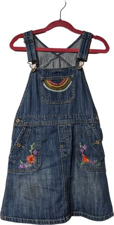 ◇ Indulge Vintage is a curated collection of unique and storied wares for maximalists ◇Oshkosh's kids’ blue and multicolor, cotton skirt overalls. Cute little hand embroidered overall dress.Excellent condition, probably a size 6/7 years. Detailed measurements (taken flat):Waist - 12 inches (double)Hip - 14 inches (double)All measurements are taken flat in inches! When considering fit, compare it to a similar garment you own that fits well. For bust, waist, and hip measurements, double it to get the full circumference.Indulge Vintage link: https://shopthrilling.com/collections/indulge-vintageGive my shop a ❤️ so you can find Indulge Vintage again! Artsy Clothing Aesthetic, Embroidered Overalls, Overalls Cute, 90s Skirt, Skirt Overalls, Kids Overalls, Overall Skirt, 90s 00s, Cotton Skirt