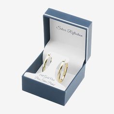 Add these Silver Reflections 24K gold over brass hoop earrings to your jewelry collection today! These hoop earrings are featured in 24K gold over brass, a sleek oval design, 40mm in length and have hinged closure. With the simple and sleek design of these hoops, they can be worn with any wardrobe choice. By adding these to your jewelry collection, you will be adding a staple piece. Earrings are boxed for gift giving! Wipe these hoop earrings clean with a soft cloth.Features: In A Gift Box, Nic… Gold Plated Hoop Earrings Gift, Classic Gold Plated Hoop Earrings Gift, Gold Hoop Earrings With Lever Back, Classic Tarnish Resistant Hoop Earrings For Gift, Classic Tarnish Resistant Hoop Earrings As A Gift, Yellow Gold Hoop Earrings Gift, Gold Nickel-free Huggie Earrings For Anniversary, Cadmium-free Hoop Earrings Gift, Gold Sterling Silver Hoop Earrings For Gift